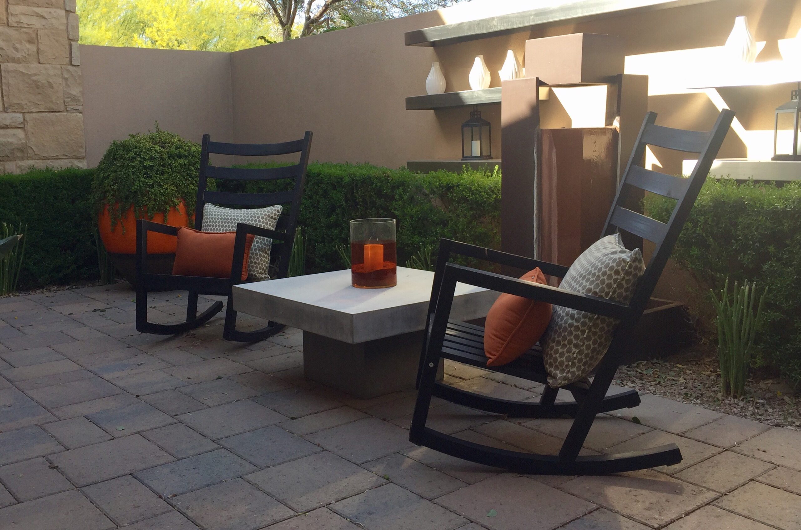 eclectic-furnishings-on-a-patio-with-rocking-chai-2026-03-17-14-42-32-utc